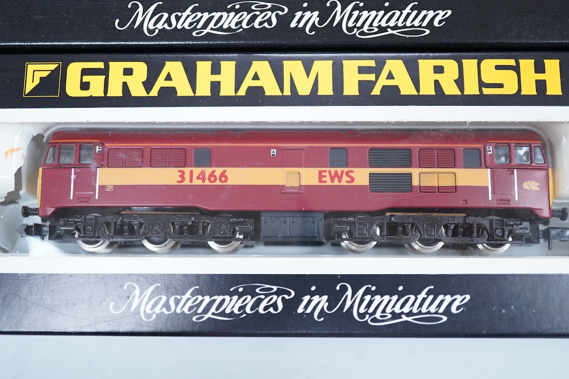 Four boxed Graham Farish N gauge railway Class 31 Co-Co diesel locomotives; a BR, 31 552 (806A), an EWS, 31 466 (806B), a BR, 31 205 (8066) and a Regional Railways, 31 421 (8067).